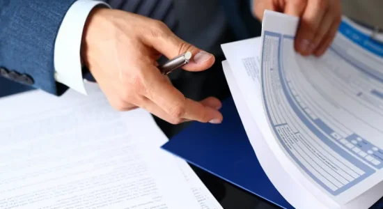 person looking at papers